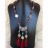 Silver necklace with dark red accessory
